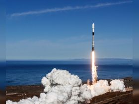 An image of a rocket launching over the ocean, showcasing the power of space exploration against a clear blue sky.