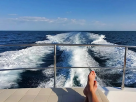 A serene view of the ocean from the deck of a boat, showcasing relaxation and the beauty of the open water — perfect for unwinding during a cruise.