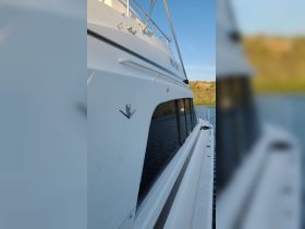 A close-up view of a boat's exterior, showcasing its sleek design and details, perfect for boat enthusiasts and charters.