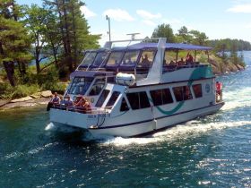 The SEA FOX II cruises through scenic waters with a group of guests enjoying the ride — perfect for sightseeing and group outings.