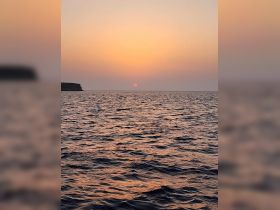 A serene sunset over the ocean, capturing the tranquil beauty of the water and sky — perfect for romantic evening cruises.