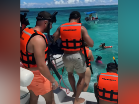 A group of snorkelers prepares to dive into the vibrant waters, showcasing the excitement of underwater exploration and adventure.