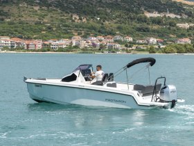 A sleek speedboat named 'Protagon' glides through clear waters, showcasing its modern design and powerful engine — perfect for thrilling day trips on the water.