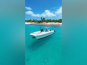 A sleek speedboat named 'Calypso' anchored in crystal-clear turquoise waters, surrounded by a picturesque beach and lush greenery — perfect for a day of adventure on the water.