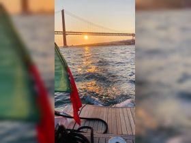 A stunning sunset view from a boat, showcasing the iconic bridge in the background and shimmering water — perfect for romantic evening cruises.