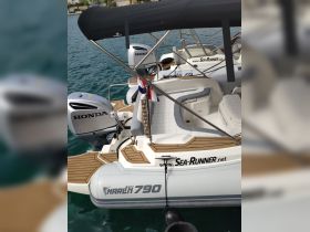 A detailed view of a Marlin 790 boat docked, showcasing its sleek design and Honda engines — perfect for water adventures.