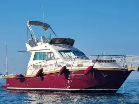 A striking view of a yacht docked in calm waters, showcasing its elegant design and features — perfect for luxury getaways or private charters.