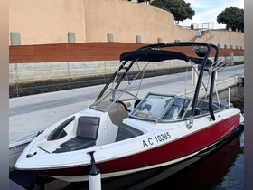 A sleek boat docked at the marina, showcasing its stylish design and readiness for water adventures.
