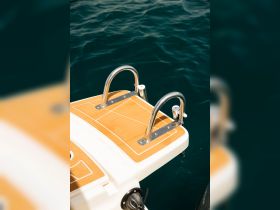 Close-up of a boat ladder on a sunny day, showcasing the sleek design and functionality for easy access to the water.