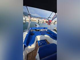 Interior view of a boat's seating area featuring a welcoming mat, perfect for relaxing while enjoying a day on the water.