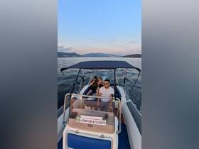 A group enjoys a scenic boat ride at sunset, capturing the essence of a perfect day on the water. Contact information for bookings is visible.