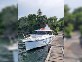 A pristine view of the 'Raffles One' yacht docked at a serene location, surrounded by lush greenery — perfect for exploring coastal waters.