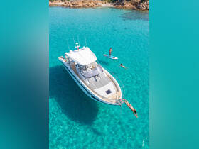 A lively scene featuring friends enjoying a day on the water, with one person diving off the boat and another paddleboarding in crystal-clear waters — perfect for summer adventures.