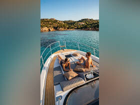 A couple enjoys a relaxing moment on the deck of a boat, surrounded by stunning coastal scenery — perfect for romantic getaways or leisurely days on the water.