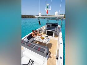 A couple enjoys a romantic dining experience on a luxury yacht, surrounded by stunning turquoise waters — perfect for special occasions or leisurely days on the sea.