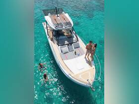 A couple enjoys a romantic moment on a boat while others swim nearby in crystal-clear waters, perfect for a memorable day on the water.