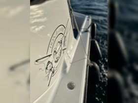 Close-up of the 'Don Ramon' boat featuring a detailed logo, perfect for sport fishing enthusiasts.