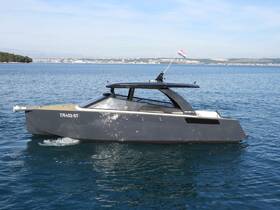 A sleek yacht glides through clear waters, showcasing its modern design and elegance — perfect for luxury cruising.