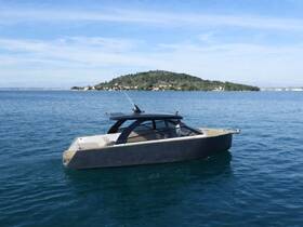 A sleek yacht cruises through clear waters, showcasing its modern design against a picturesque island backdrop — perfect for luxury boating experiences.