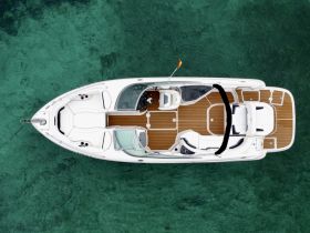 Aerial view of a sleek boat showcasing its elegant design and spacious deck, perfect for enjoying the open waters.