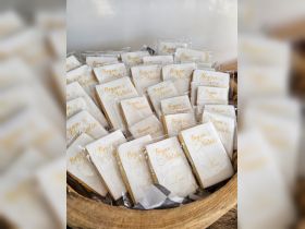 A beautifully arranged display of wedding cookies featuring the names Bryan and Natalie, perfect for celebrating love on a special day.