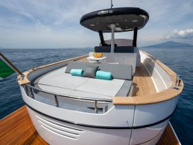 A stunning view of the Gozzo 35 yacht showcasing its spacious deck and elegant design, perfect for luxurious outings on the water.