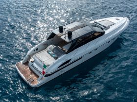 A stunning aerial view of the Meryrose yacht gliding through sparkling waters, showcasing its sleek design and luxurious features.