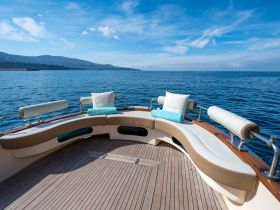 A beautifully designed lounge area on a boat, featuring comfortable seating and stunning views of the open water — perfect for relaxation while cruising.