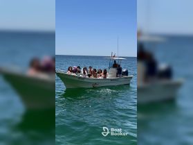 A lively group enjoys a day out on the water aboard a boat, perfect for celebrations and fun gatherings with friends.
