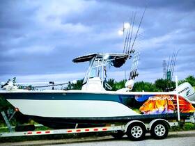 A striking side view of a fishing boat on a trailer, showcasing its vibrant design and fishing gear, perfect for anglers looking for their next adventure.