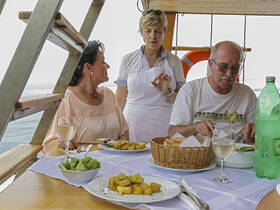 Guests enjoying lunch on boat