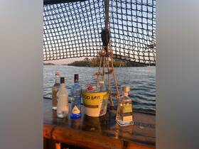 A selection of premium spirits and mixers displayed on a boat, perfect for creating cocktails while enjoying a scenic view on the water.