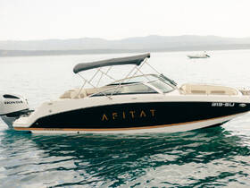 A sleek speedboat named 'AFITAT' docked in calm waters, showcasing its elegant design and Honda engine — perfect for a day on the water.
