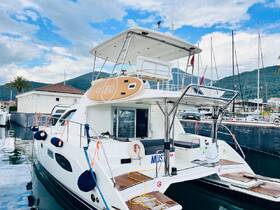 A sleek yacht docked at the marina, showcasing its elegant design and inviting atmosphere, perfect for luxury boating experiences.