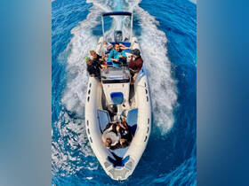 A lively group enjoys a fun day on a speedboat, capturing the excitement of on-water activities in vibrant blue waters.
