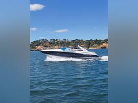 A sleek speedboat named 'Timeless Moments' glides through the water, showcasing its elegant design and performance on a sunny day.