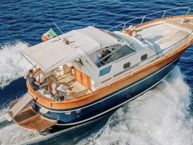 A group enjoys a sunny day aboard a yacht, cruising through vibrant blue waters — perfect for relaxation and adventure on the open sea.