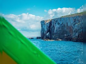 A stunning view of a coastal landmark from the water, showcasing the natural beauty of the landscape — perfect for adventure seekers and nature lovers.