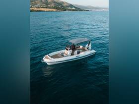 A sleek speedboat navigates the tranquil waters, showcasing its stylish design and perfect for a day of adventure on the sea.