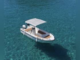 A stunning aerial view of a sleek boat gliding through crystal-clear waters, perfect for exploring coastal destinations or enjoying a day on the water.