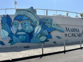 A vibrant mural at Marina de Cascais, showcasing artistic elements and local culture, perfect for photography enthusiasts.