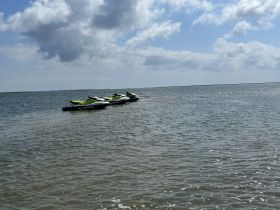 A pair of jet skis anchored in calm waters, perfect for thrilling water adventures and exploring coastal areas.
