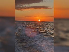 A stunning sunset over the ocean, capturing the tranquil beauty of the sea — perfect for romantic evenings or peaceful boat rides.