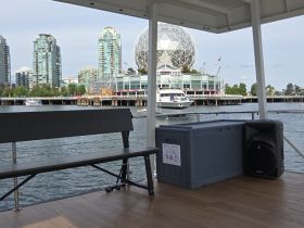 Interior view of a boat featuring a spacious seating area, ideal for relaxing while enjoying the waterfront scenery.
