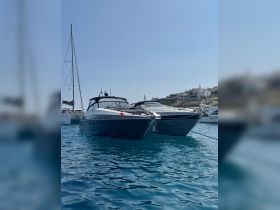 A stunning view of a sleek yacht docked in crystal-clear waters, showcasing the beauty of maritime leisure and luxury.