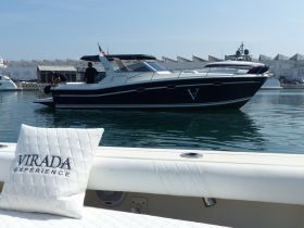 A sleek boat is seen at the dock with crew members preparing for departure, showcasing the vibrant boating experience.