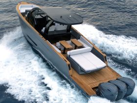 A sleek speedboat glides through the water, showcasing its modern design and spacious seating — perfect for thrilling adventures on the open sea.