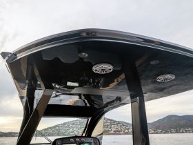 A sleek view of the helm area inside a modern boat, showcasing the stylish design and functional features ideal for navigation.