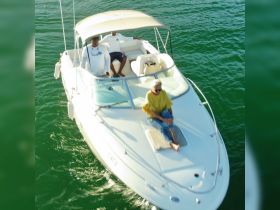 A group enjoys a leisurely ride on a boat, capturing the essence of relaxation and fun on the water.