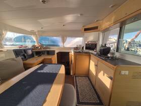 Interior view of a well-designed boat cabin featuring a spacious seating area and modern amenities, perfect for comfortable cruising.
